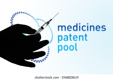 May 6, 2021, Brazil. In This Photo Illustration The Medical Syringe Is Seen With Medicines Patent Pool (MPP) Logo Displayed On A Screen In The Background