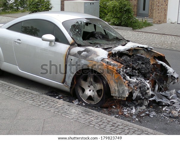 MAY 8, 2013 - BERLIN: a burned out Audi TT sports\
car in the Friedrichshain district of Berlin - vandalism acts like\
this have become a common sight in the German capital these\
days.