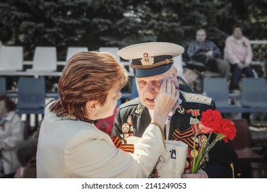 May 9, 2015 Kolomna, Moscow Region, Russia. Victory Day Holiday. Emotions Of An Old Veteran. The Daughter Wipes The Tears Of The Old Father. Memorial Day Of The Great Patriotic War