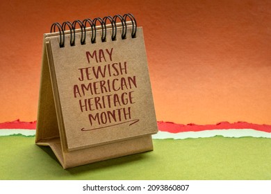 May American Jewish Heritage Month - handwriting in a small desktop calendar against abstract paper landscape, reminder of cultural event