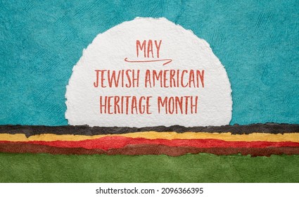 May American Jewish Heritage Month - handwriting on a round sheet of watercolor paper against abstract landscape, reminder of cultural event