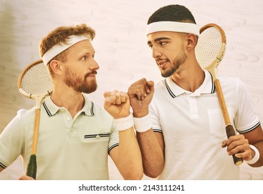 May The Best Man Win. Shot Of Two Young Men Fist Bumping Before Playing A Game Of Squash.