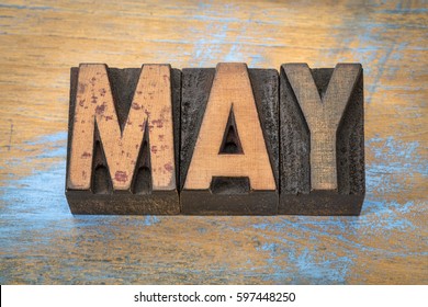May Month In Vintage Letterpress Wood Type Against Grunge Wooden Background