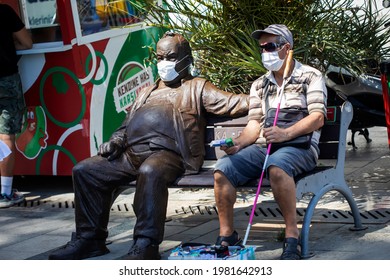  May-20-2021- Izmir, Turkey. The Handkerchief Seller Is Sitting In The Banch And Wearing His Mask. You Must Wear A Face Mask By Law.