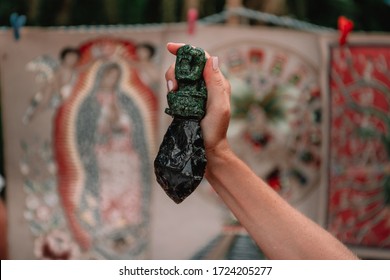 Mayan Obsidian Sacrifice Knife In A Female Hand.