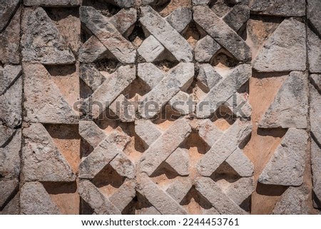 Mayan style fretwork, in an archaeological zone, approach to Mayan buildings, view of the details made by the Mayans in pre-Hispanic times, glyphs and representations of deities