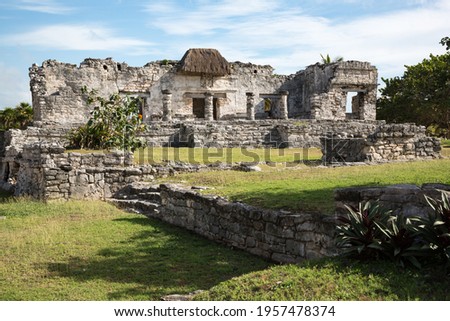 Mayan temple ruins with a thatched roof over a descending god fresco in Tulum, Quintana Roo, Yucatan peninsula, Mexico