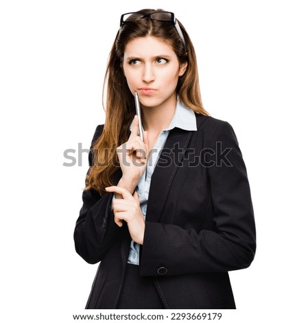 Maybe I should get a second opinion. Shot of a young businesswoman day dreaming against a studio background.