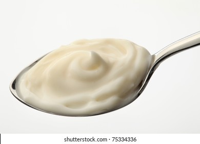 Mayonnaise On A Spoon With White Background