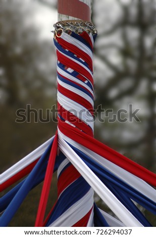 A maypole with ribbons