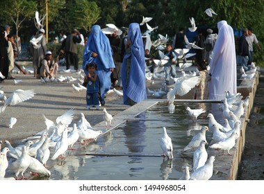 Mazar-i-Sharif, Balkh Province / Afghanistan - Aug 31 2005: People And Birds Outside The Blue Mosque In Mazar I Sharif. The Mosque Is Famous For Its White Doves Or Pigeons. Northern Afghanistan.