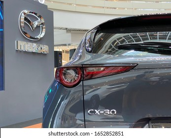 Mazda Roadshow at Queensbay mall Penang, Malaysia - 22 February 2020 - new launching Mazda CX-30 side view with Mazda logo as background
