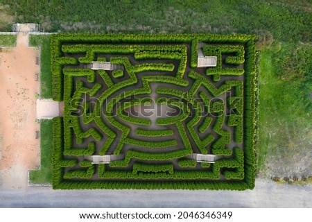 Maze of bushes in botanical park - nature background 
Labyrinth from above. Aerial view
Natural maze from the hedge, good fun and entertainment