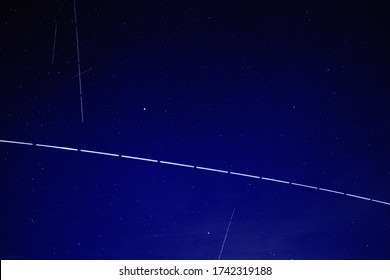 Mazowsze, Poland - 05 27 2020: ISS International Space Station And Satellites Network Visible At Night Sky. United States Space Force. Radarsat GPS Network Internet 5G Starlink SpaceX Crew Dragon