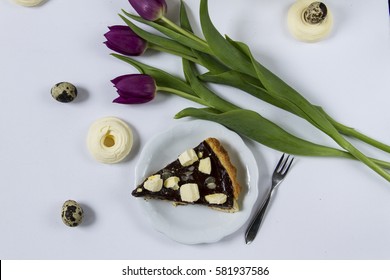 Mazurek- traditional Easter cake from Poland. White background, tulips. 