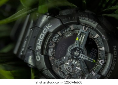 
MAZYAD MALL, ABU DHABI, UAE - 17th December 2018 : Casio G - Shock Watch On Display On A Wet Green Grass 