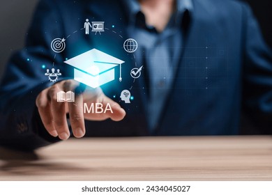 MBA, Master of Business Administration program concept. Courses to developing skills in business and management fields. Businessman touching MBA icon on virtual screen.