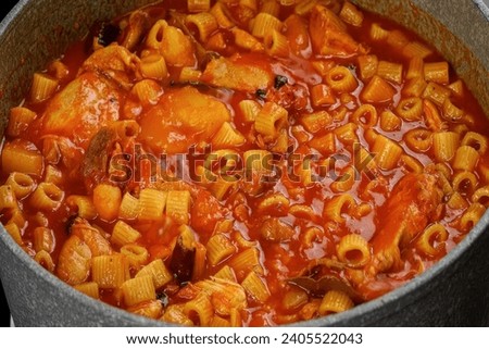 Mbakbka, Mbakbaka Libyan Pasta Stew is one of the quickest Libyan meals to prepare for lunch or dinner. Any type of pasta is cooked in a red chili sauce with meat, chicken, or sea food Сток-фото © 