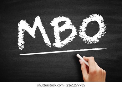 MBO Management By Objectives - Strategic Approach To Enhance The Performance Of An Organization, Acronym Text On Blackboard