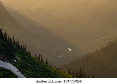 McDonald Creek Winds Through Valley In Soft Afternoon Light From Overlook On Logan Pass