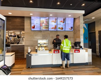 McDonalds Employee Taking A Customers Order.