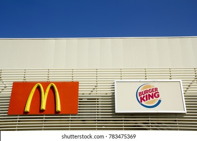 McDonald's fast food restaurant and Burger King fast food restaurant signboards are on the exterior wall of the shopping mall on Balcova Street in, Izmir, Turkey- March 24, 2015