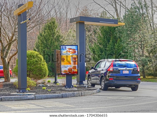 McDonald\'s fast food restaurant menu ordering drive\
thru, Saugus Massachusetts USA, April 8, 2020                      \
       
