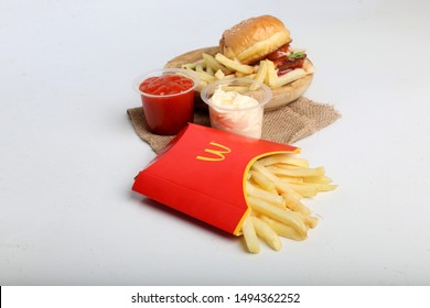mcdonald's hamburger with french fries on white background isolated. yogyakarta indonesia. september 02, 2019.