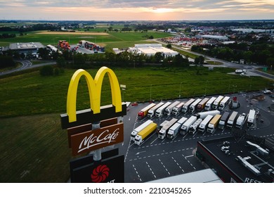 McDonalds Logo With McCafe Sign Near Highway, Aerial View. McDonald's Restaurant Biggest Fast Food Company In World. Katy Wroclawskie, Poland - June 17, 2022