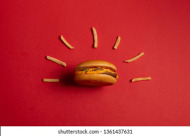 McDonald's menu: French fries and burger on red background. Minimal concept
