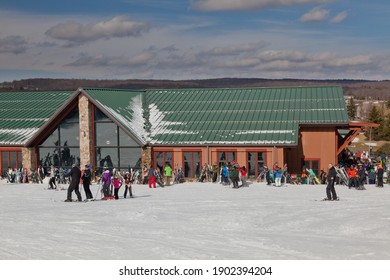 MCHENRY, MD, UNITED STATES - Feb 24, 2016: Skiers mill about in front of the Wisp Ski Lodge in McHenry, MD