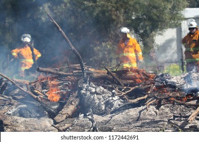 McLAREN VALE, SOUTH AUSTRALIA, AUGUST 2018; volunteer firefighters from the Country Fire Service are obscured by the rising heat in a training exercise in preparation for the coming fire season.