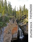 McNally Creek Territorial Park, Northwest Territories in Canada. The McNally Creek Waterfall shown from above has low water in the autumn.