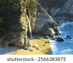 McWay Falls in Big Sur, California, is a stunning 80-foot waterfall that cascades directly onto a secluded beach along the Pacific coastline. Nestled within Julia Pfeiffer Burns State Park.