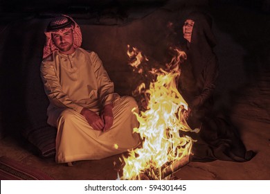 Me and my wife by the campfire by the desert safari camp, Dubai February 2017,happy healthy attractive smiling couple by the campfire in the duba desert with traditional clothes
