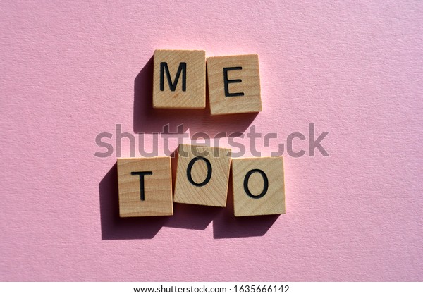 Me Too, Words in 3d wooden alphabet letters on\
a pink background