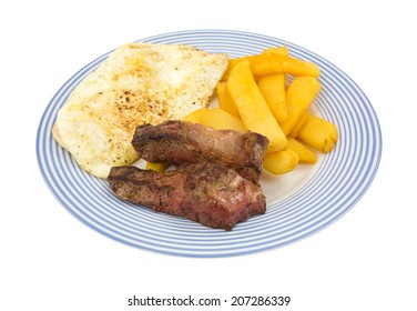 A Meal Of Fried Strip Steak With Eggs And Potatoes On A Blue Striped Plate Atop A White Background.