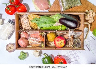 Meal Kit Delivery Concept. Set Various Healthy Dishes Food Ingredients Meat, Vegetables, Fruit, Spices With Recipes For Cooking. Online Ordering Chef Foods Ingredients, Grocery Delivery