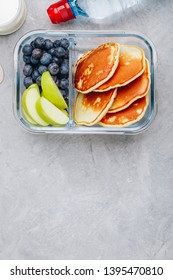 Meal Prep Containers With Pancakes, Blueberry And Apple. Breakfast In Lunch Box. Top View, Copy Space.