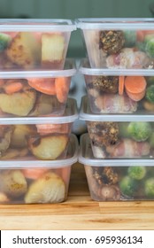 Meal Prep. Stack Of Home Cooked Roast Chicken Dinners In Containers Ready To Be Frozen For Later Use. Vertical.