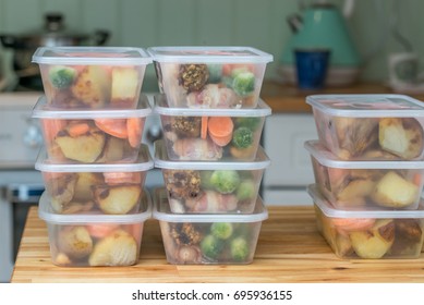 Meal prep. Stack of home cooked roast chicken dinners in containers ready to be frozen for later use as quick and easy ready meals.