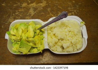 A Meal Of Sliced Avocado And Thick Mealie Meal Poridge And Seasoning.