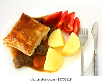 A Meal Of Steak Pie, With A Puff Pastry Crust, Viewed From Above