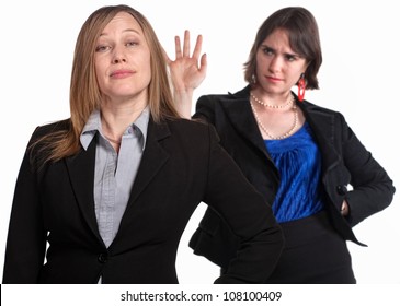 Mean Female Co-workers Over White Background