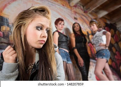 Mean Group Of People Looking Over At Insecure Teen