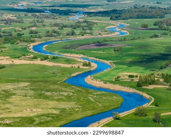 Meandering Narew river near Tykocin in Poland - drone aerial view, landscape photography, green fields, meadows, sunny day - Powered by Shutterstock