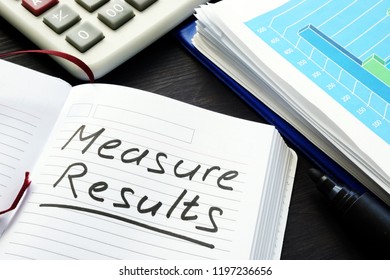 Measure Results Written By Hand In A Note Pad.