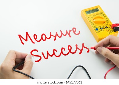 Measure Of Success Conceptual Using Digital Multimeter