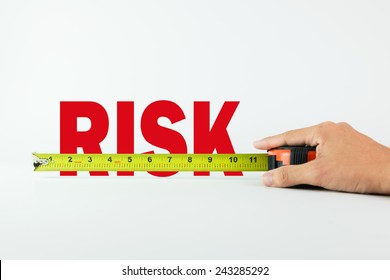 Measure The Word Risk With Measuring Tape On White Background