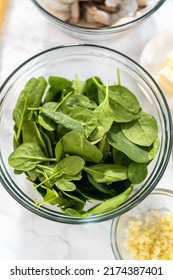 Measured Ingredients In Glass Mixing Bowls To Prepare Garlic Shrimp Pasta With Spinach.